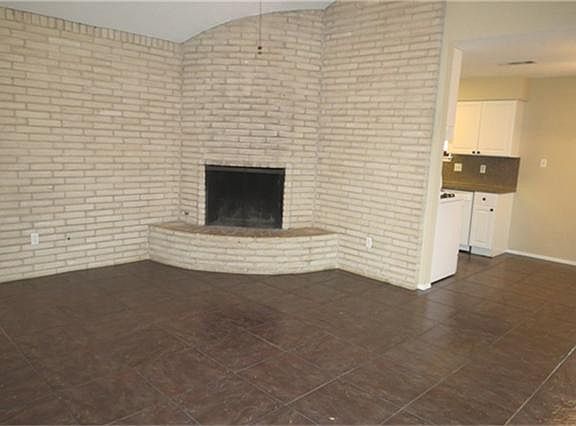 Family room with corner fireplace.