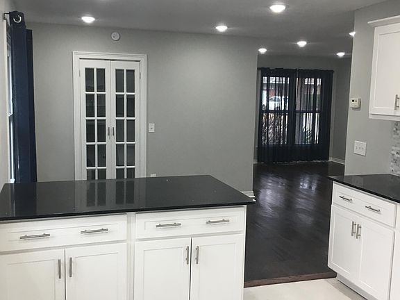 OPEN FLOOR PLAN FROM KITCHEN TO LIVING AREA - ALL NEW CAN LIGHTING