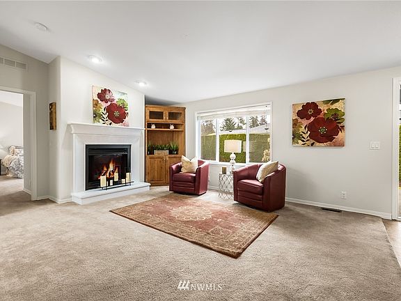 Living room with a gas fireplace. 