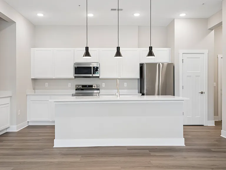 Kitchen with appliances of an apartment home.