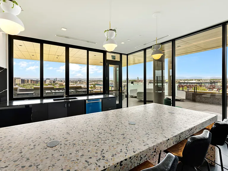 Modern kitchen with ample space to entertain guests, complete with two wine fridges and ice maker