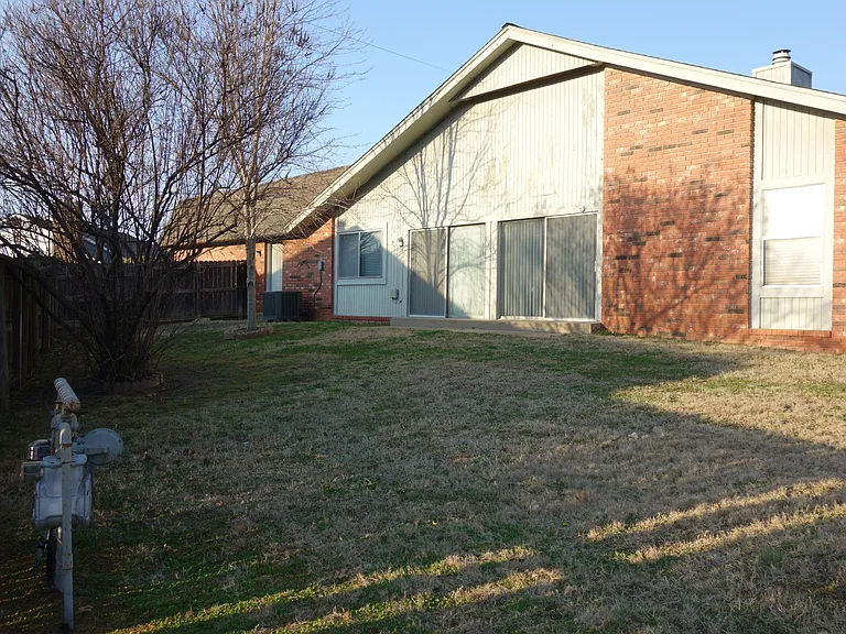 More view of the backyard. the visible sliding doors lead to the living room!