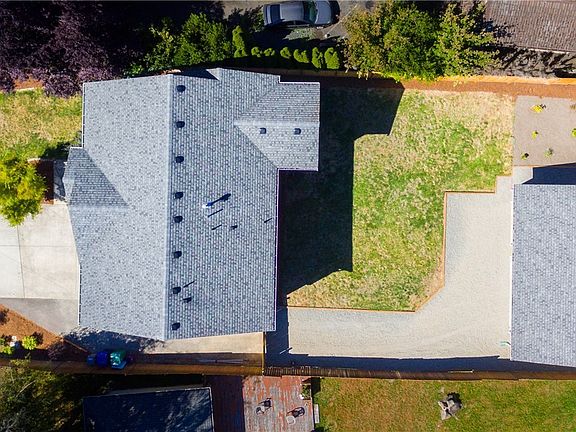 Top down showing the space of the front and back yard. Notice the big lawn area and garden space to the left of the detached gar