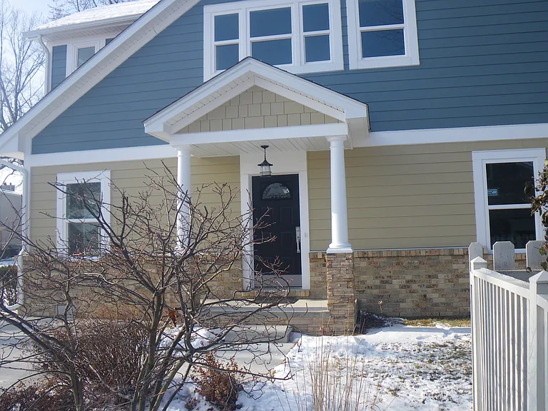 Welcome into a graceful enteranceway. To the left is a study/bedroom with closet & ensuite bath with shower for single floor living. Right is an open plan kitchen, living, dining room w/gas fireplace. Laundry & pantry tucked behind.