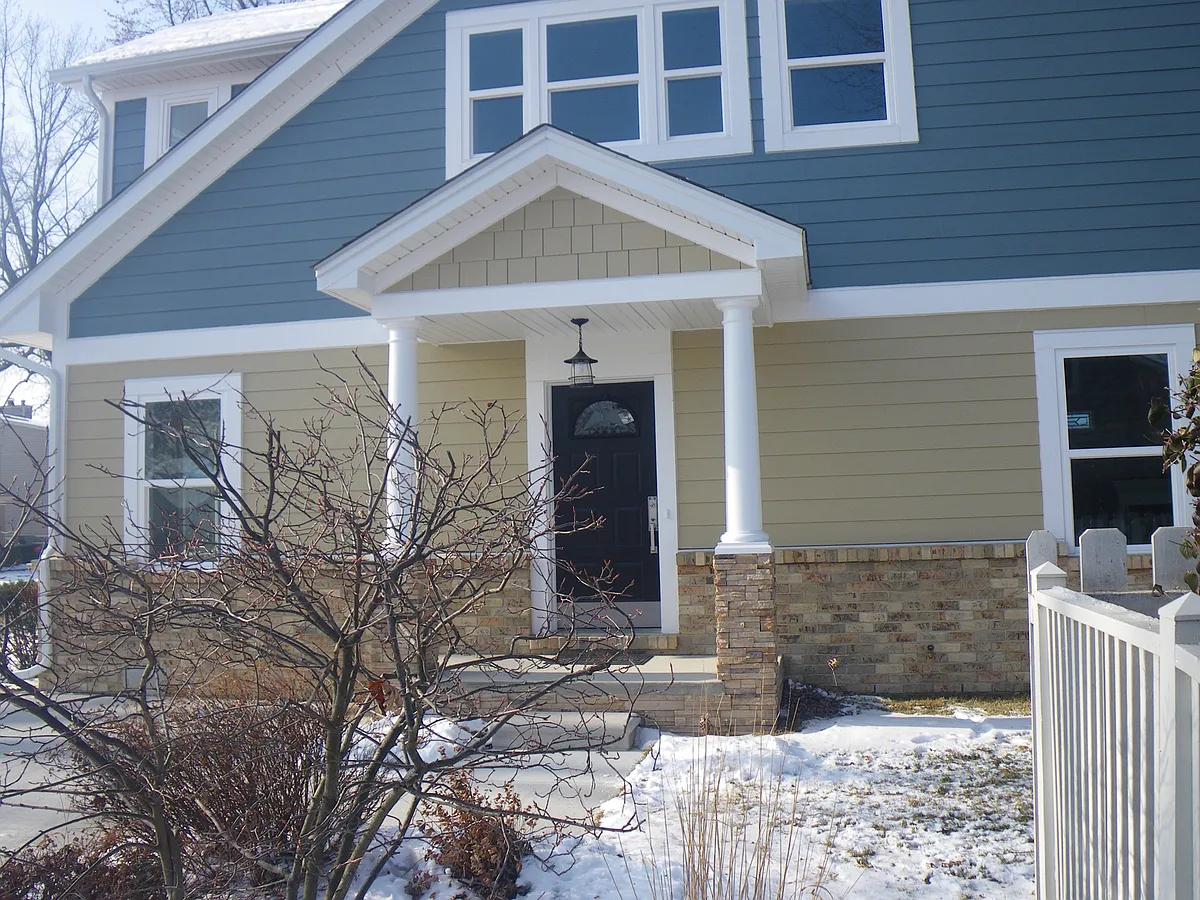 Welcome into a graceful enteranceway. To the left is a study/bedroom with closet & ensuite bath with shower for single floor living. Right is an open plan kitchen, living, dining room w/gas fireplace. Laundry & pantry tucked behind. - 22485 Milner St
