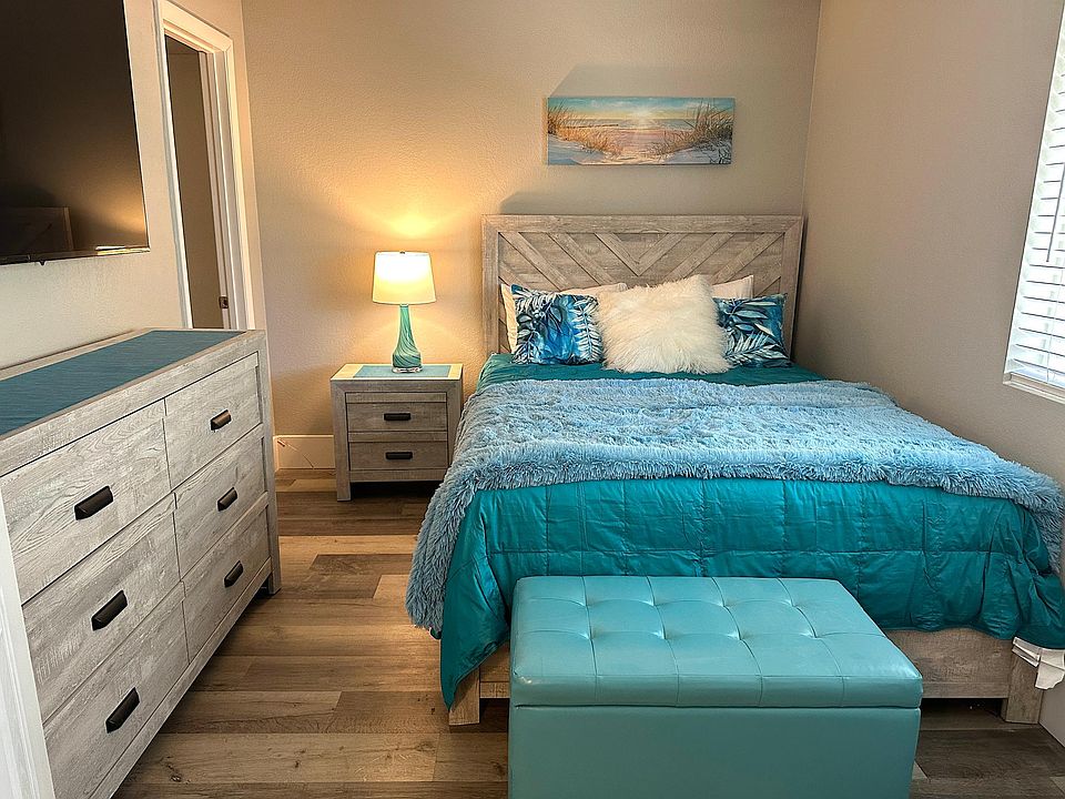 Queen Bedroom has same dreamy decor to melt to sleep and 65" new Sony Smart TV.