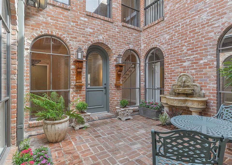 Stunning courtyard entrance welcomes you and your guests to this home. All rooms around the courtyard have windows overlooking the peaceful outdoor space.