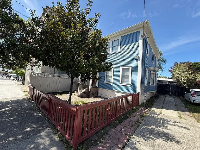 Off-street parking: Driveway fits two cars parked in tandem along the east side of the house