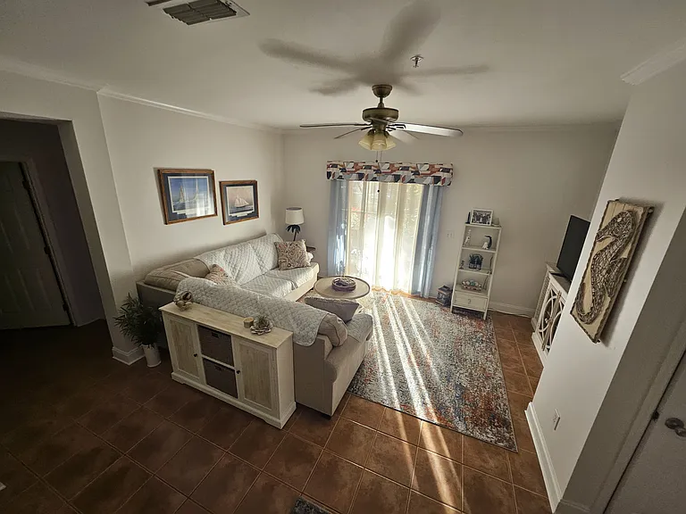 living room with slider to lanai