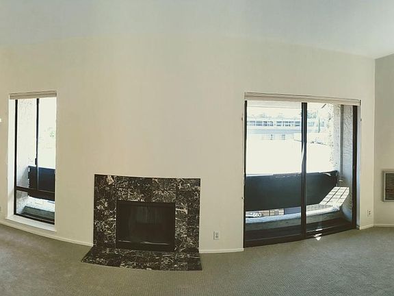First bedroom and living room with fireplace
