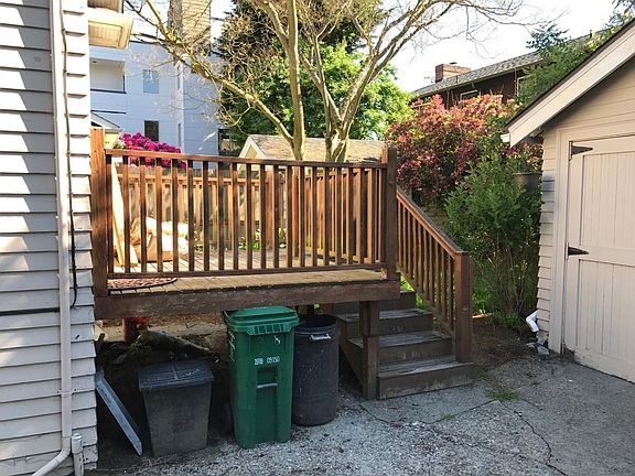 View from off-street parking to small backyard