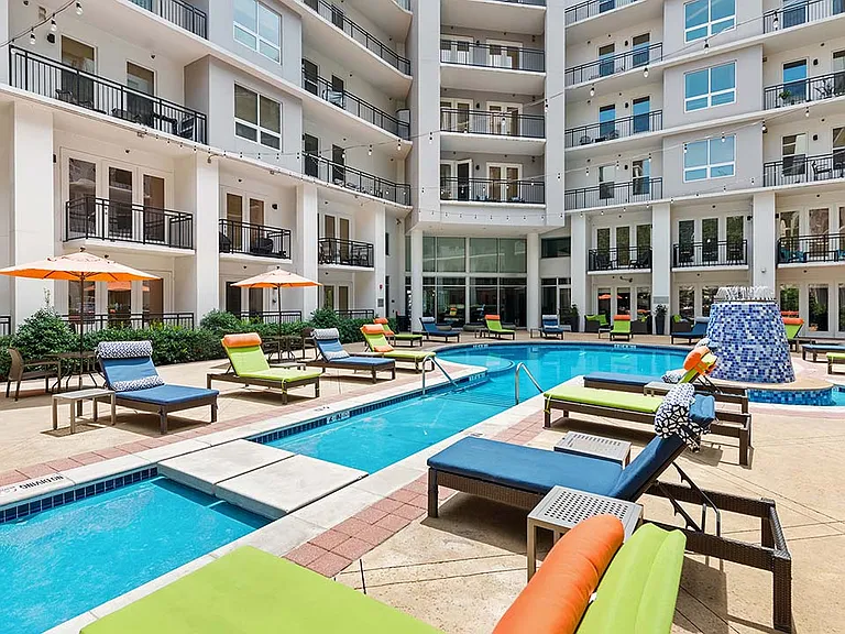 Griffis Uptown resort-style pool area with lounge chairs.