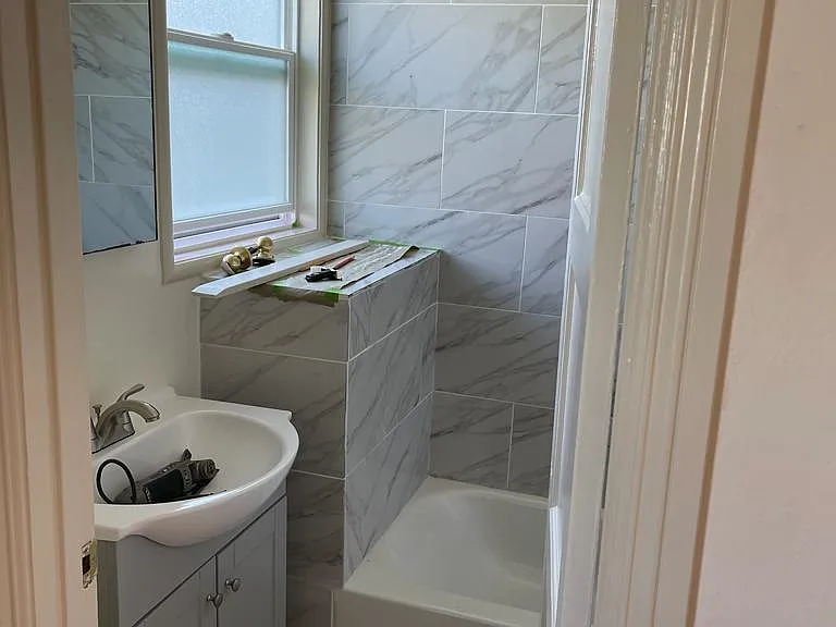 Brand new bathroom with shower over tub