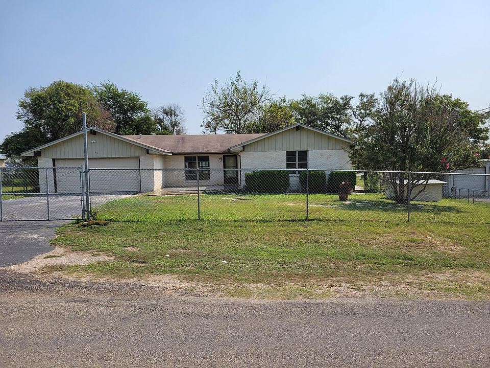 front of the house with the 2 car garage. and fenced yard