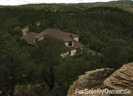 Exterior. View from top of Mound. Pinon Pine, Cedar & Juniper Trees grow around.