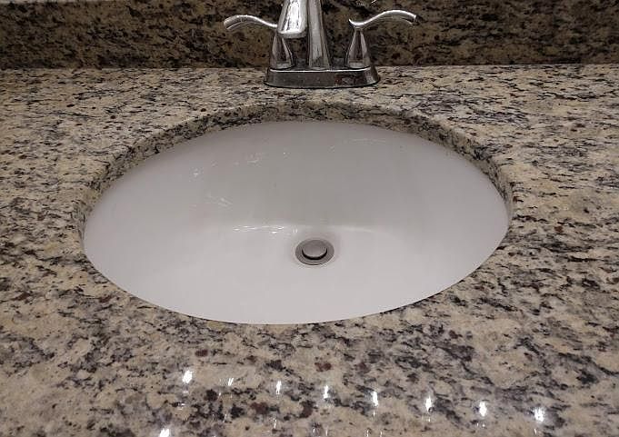 Granite counter in bathroom.