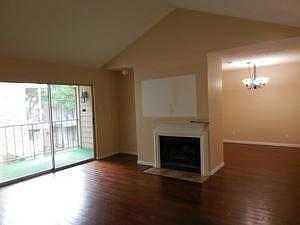 living room with fireplace is open to dining