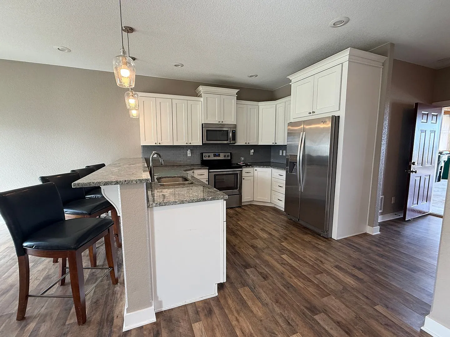 Spacious 4-Bedroom Twin Home | 3-Stall Garage + Fenced Yard — Photo 3