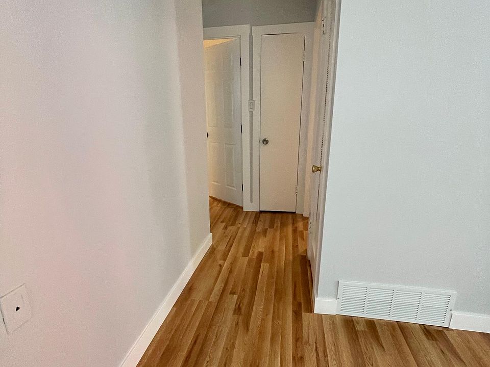 hallway to bathroom and two bedrooms