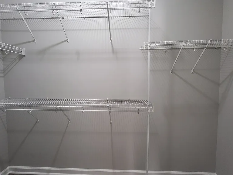 Walk in closet in main bedroom downstairs