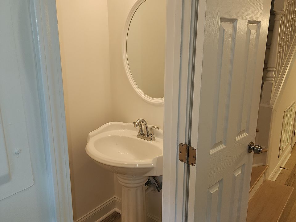 HALF BATH WITH PEDESTAL SINK & TOILET ON LEFT