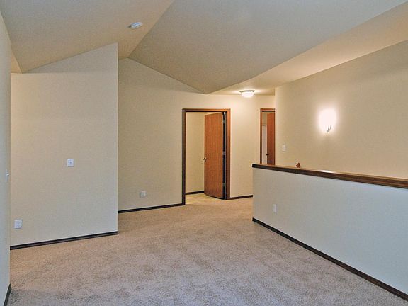 Upstairs offers 4 bedrooms, 2 bathrooms, laundry, and bonus room.