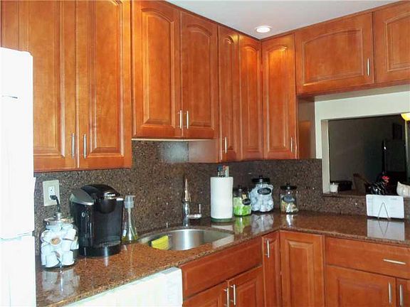 Kitchen with Passthrough to living room, Disposal installed.