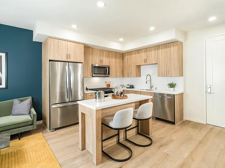 Gourmet kitchens with quartz countertops, 42-inch custom cabinetry, and upgraded fixtures