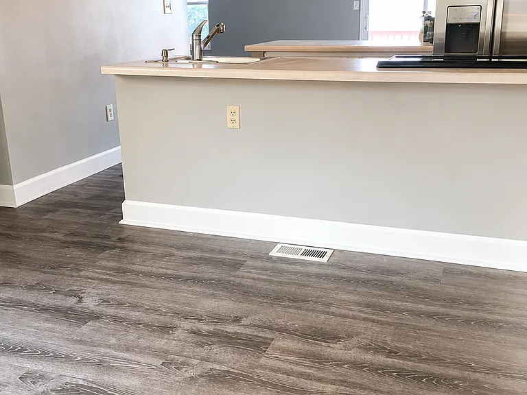 Far side of kitchen. Can put barstools under counter and use for entertaining