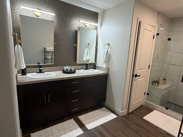 Master double sink area. Newly installed faucets and lighting. Plush towels in both bathrooms.