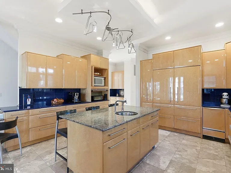Sleek modern kitchen with vibrant accents.