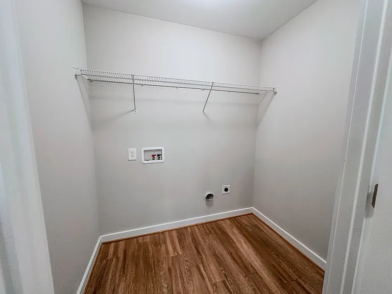 The unit includes a large laundry room with washer and dryer hookup.
