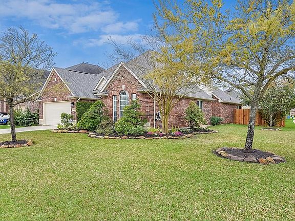Large corner lot with tons of luscious landscaping though out the whole property. A new fence has been added as well.