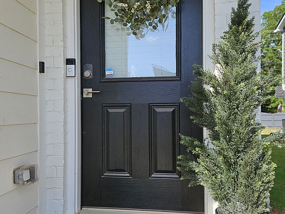 Staged to feel like home_this welcoming front entry features curated touches and clean lines that make a lasting first impression.