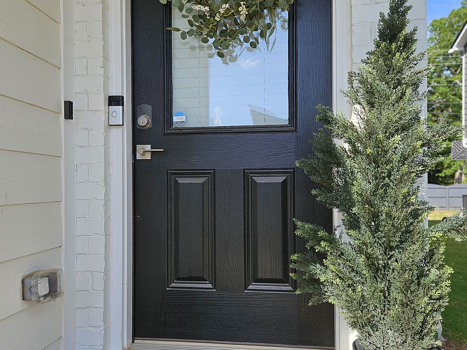 Staged to feel like home_this welcoming front entry features curated touches and clean lines that make a lasting first impression.
