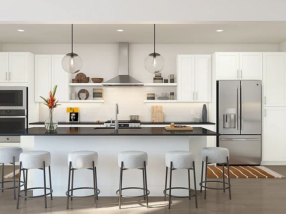 Kitchen with pendant lighting and floating shelves