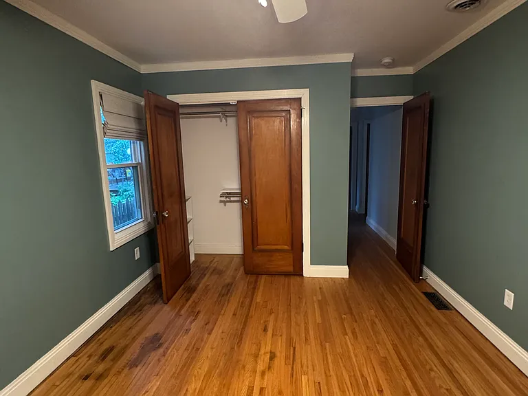 main floor front bedroom, looking to back at second closet