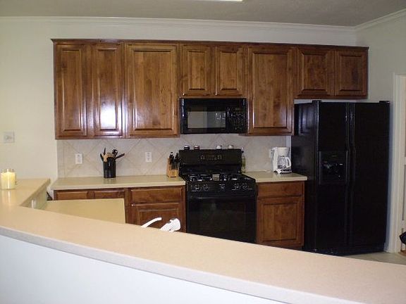 Corian countertops! Appliances are staying