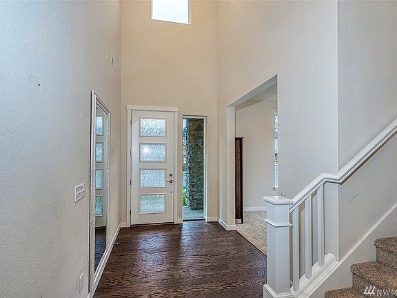 Skylight above the door adds light to this elegant entrance