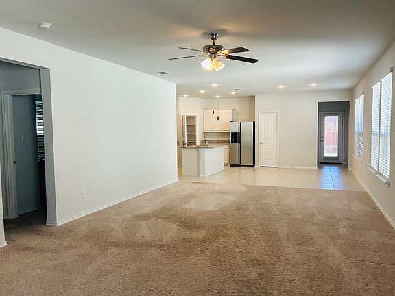 The spacious living area offers plenty of room for two separate seating areas, making it ideal for both relaxing and entertaining. Whether you want a cozy spot for TV nights or a conversation corner for guests, this flexible layout gives you options.
