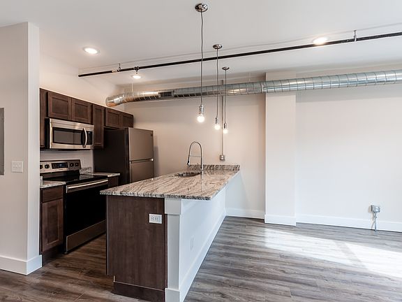 Solid wood cabinetry, granite counters, fully equipped kitchen.