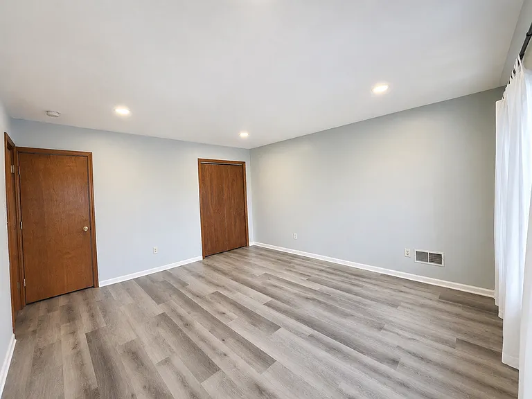 Bright bedroom with generous wall space