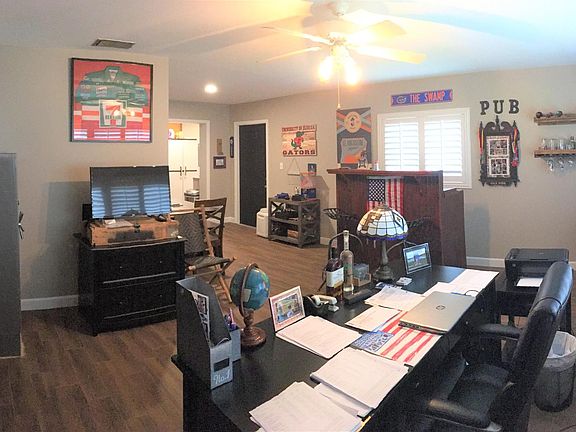 Family room in the back of the home with working fireplace