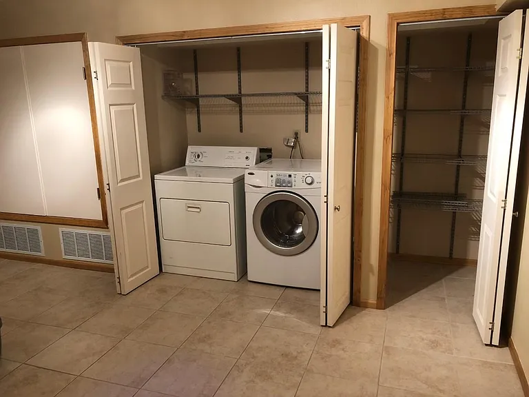 Mud Room with mechanical closet, washer/dryer and storage closet
