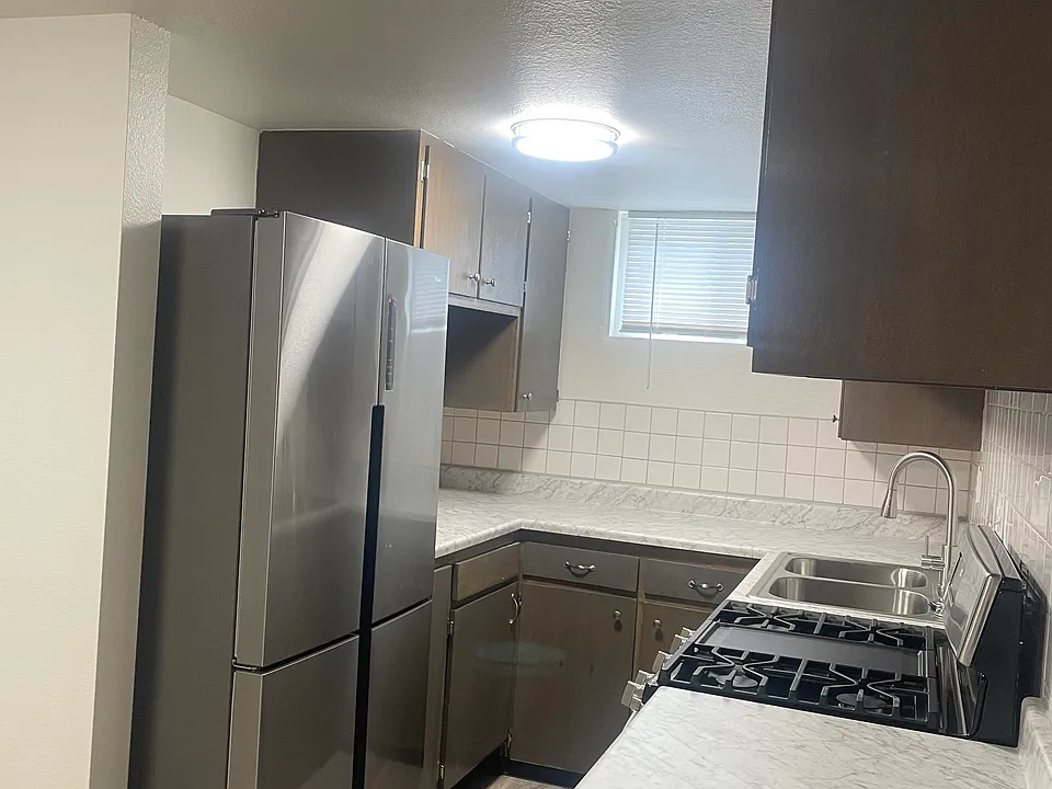 Brand new refrigerator and gas range.