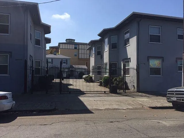 Street view. House in back of property