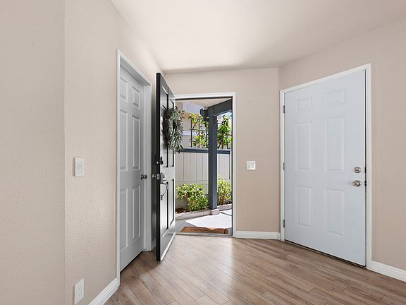(Left to right) - Downstairs bathroom, front door, garage door