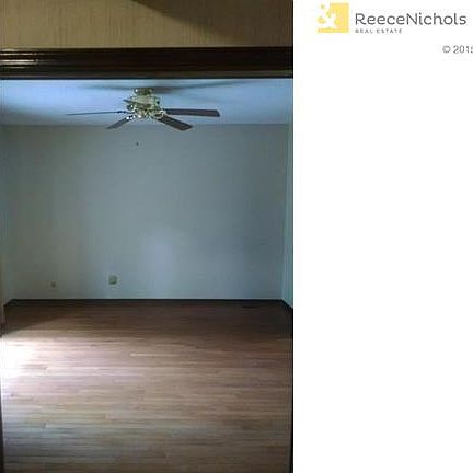 First floor bedroom with step-in closet and access to rear deck.  Wood floors.