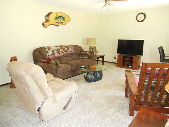 The front door opens to the living room.  The entire home received new carpet 1.5 years ago.