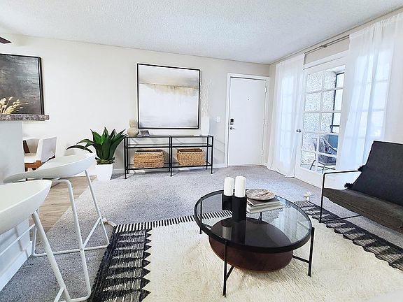 Your spacious living room features doors leading out to your very own patio.